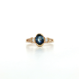 Oval Shape Sapphire & Round Brilliant Cut Colorless Diamond Ring (1 ⅒ ct. tw.) in 14k Yellow Gold