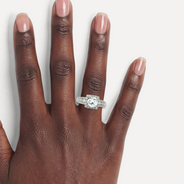 GIA Certified Colorless Near-Flawless Halo Diamond Engagement Ring (2 ct. tw.) in 18k White Gold shown on a hand (deep skin tone)
