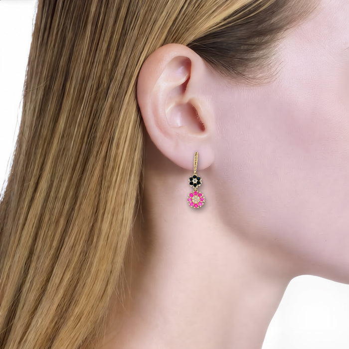 Vivid Blue Sapphire, Vivid Pink Sapphire & Diamond Floral Dangle Earrings (2 ⅔ ct. tw.) in 14k Yellow Gold shown on the ear (light skin tone)