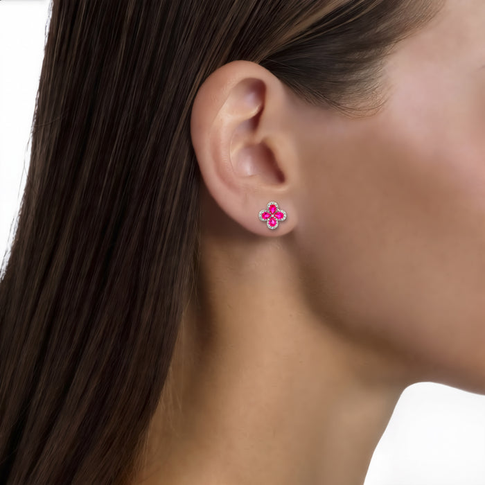 Pear Vivid Ruby Colorless Nearly Flawless Diamond Flower Stud Earrings (2 ⅓ ct. tw.) in 18k White Gold shown on the ear (medium skin tone)