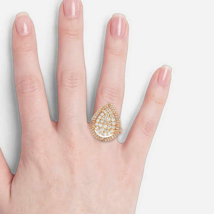 Pear-Shaped Nearly Flawless Colorless Diamond Cluster Ring (1 ¼ ct. tw.) in 18k Rose Gold shown on a hand (light skin tone)