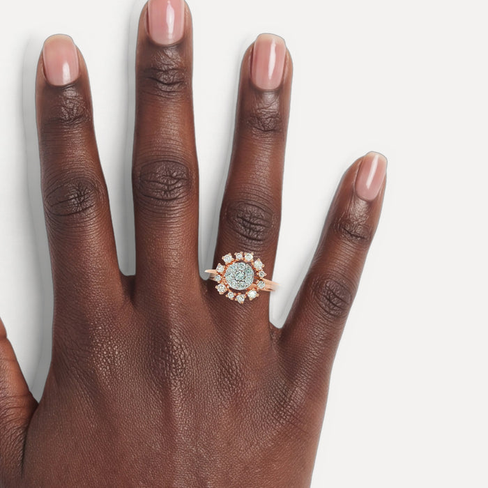 Round Brilliant Cut Diamond Flower Burst Ring (⅗ ct.) in 14k Rose Gold shown on a hand (deep skin tone)