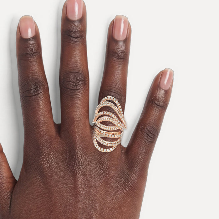 Round Brilliant Cut Pavé Nearly Flawless Colorless Diamond Swirl Ring (1 ⅗ ct.) in 14k Rose Gold shown on a hand (deep skin tone)