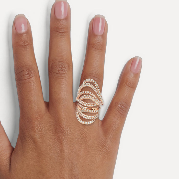 Round Brilliant Cut Pavé Nearly Flawless Colorless Diamond Swirl Ring (1 ⅗ ct.) in 14k Rose Gold shown on a hand (medium deep skin tone)