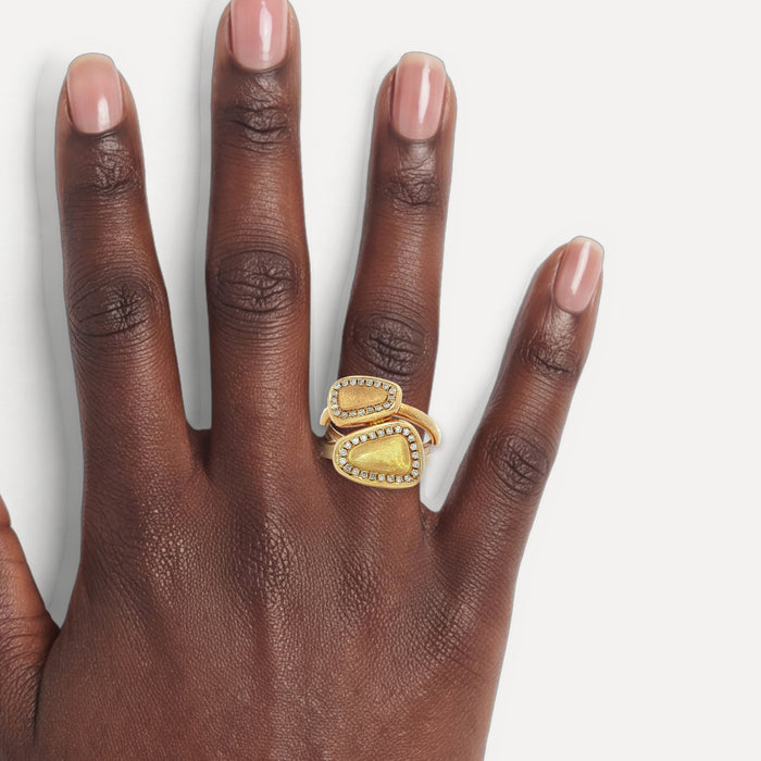 Round Brilliant Cut Near-Colorless Diamond "Toi et Moi" Split Shank Bypass Ring (¼ ct.) in 14k Yellow Gold shown on a hand (deep skin tone)