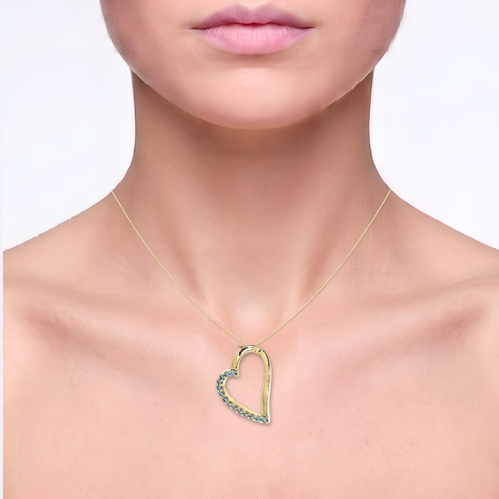 Vivid Swiss Blue Topaz Pendant Necklace (1 ⅖ ct. tw.) in 14k Yellow Gold Heart shown on the neck (light skin tone)