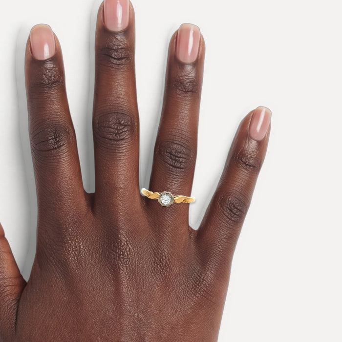Certified Solitaire Colorless Near-Flawless Diamond Engagement Ring (⅕ ct.) in 18k Yellow Gold & Platinum shown on a hand (deep skin tone)