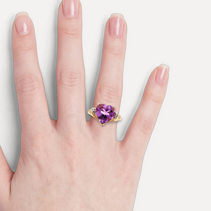 Heart Shape Amethyst & Diamond Ring (3 ¼ ct. tw.) in 10k Yellow Gold shown on a hand (light skin tone)