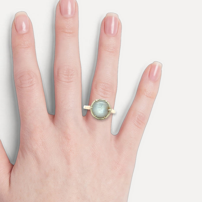 Antique Victorian Cabochon Moonstone Ring (5 ct.) in 14k Yellow Gold Sterling Silver shown on a hand (light skin tone)