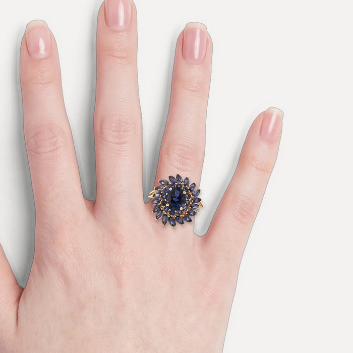 Iolite Sunburst Ring (2 ¾ ct.) in 10k Yellow Gold with Oval Brilliant Cut, Round Brilliant Cut, & Marquise Brilliant Cut Iolite shown on a hand (light skin tone)
