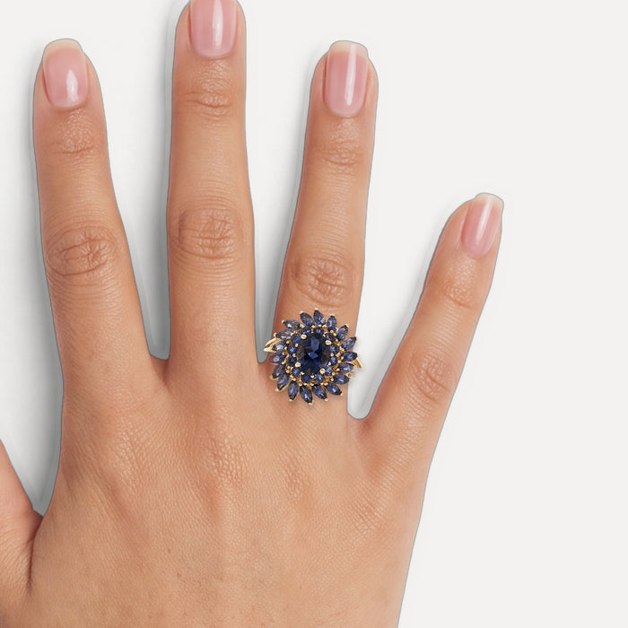 Iolite Sunburst Ring (2 ¾ ct.) in 10k Yellow Gold with Oval Brilliant Cut, Round Brilliant Cut, & Marquise Brilliant Cut Iolite shown on a hand (medium skin tone)