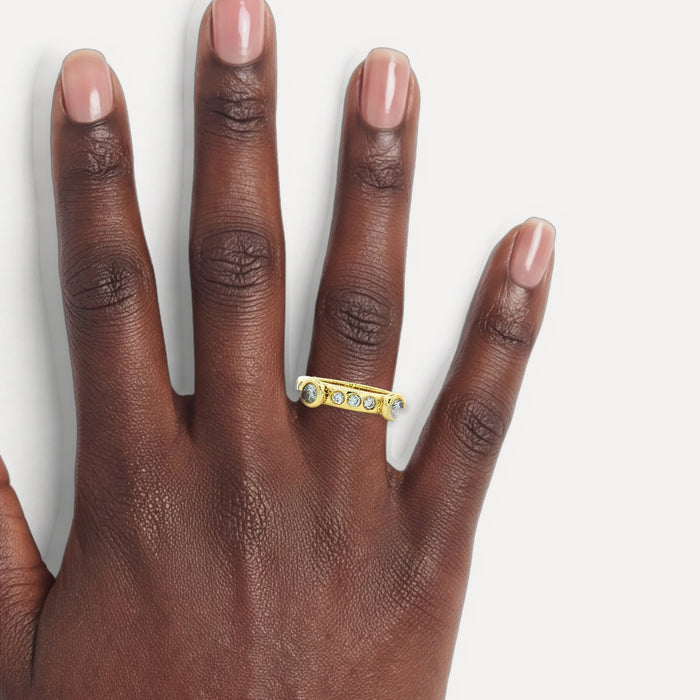 Stackable Nearly Flawless Colorless Diamond Ring (⅔ ct.) in 18k Yellow Gold shown on a hand (deep skin tone)