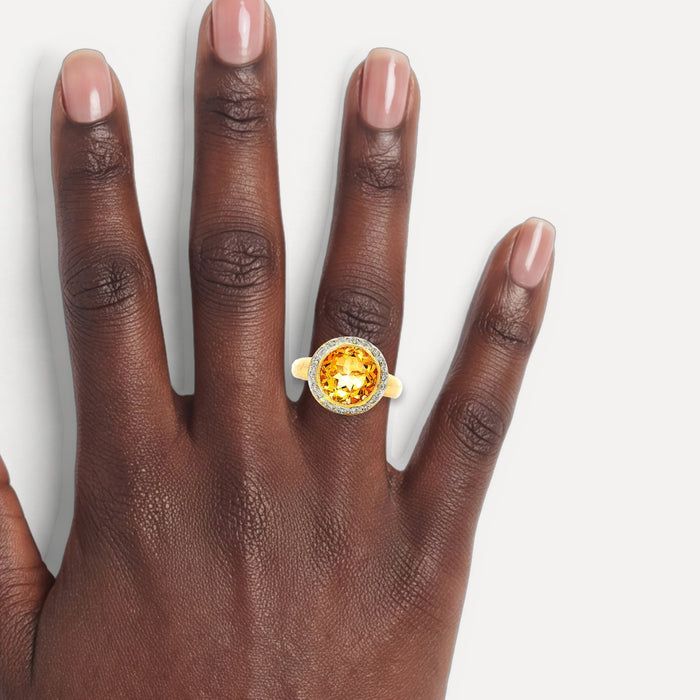 Rich Honey-Amber Citrine & Diamond Halo Ring (3 ⅔ ct. tw.) in 18k Yellow Gold shown on a hand (deep skin tone)