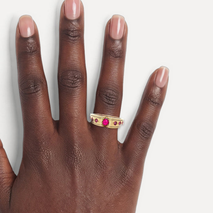 Round Brilliant Cut Bezel-Set Ruby Ring (¼ ct.) in 14k Yellow Gold shown on a hand (deep skin tone)