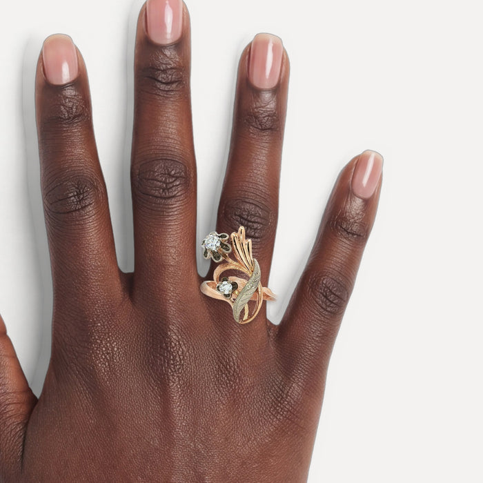 Vintage 1940s Floral Diamond Cocktail Ring (¼ ct.) in 14k Rose Gold & White Gold shown on a hand (deep skin tone)