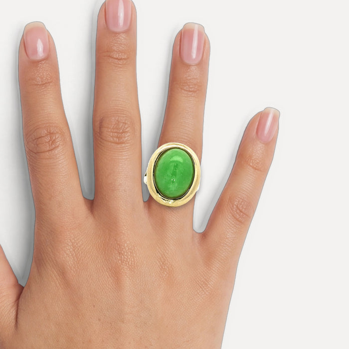 Oval Cabochon Jade Bezel-Set Ring (8 ⅓ ct.) in 14k Yellow Gold shown on a hand (medium skin tone)
