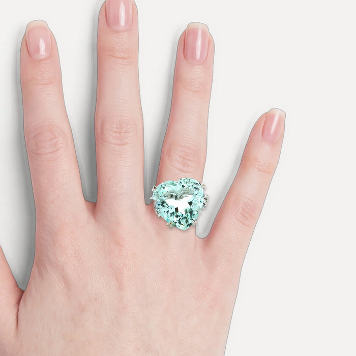GIA Certified Heart-Shaped Vivid Aquamarine & Diamond Ring (25 ½ ct. tw.) in Platinum shown on a hand (light skin tone)