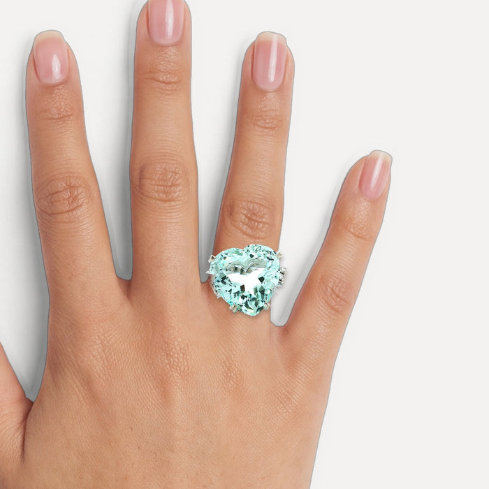 GIA Certified Heart-Shaped Vivid Aquamarine & Diamond Ring (25 ½ ct. tw.) in Platinum shown on a hand (medium skin tone)