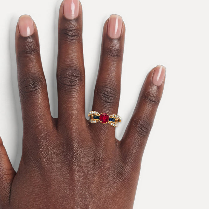 Deep Red Ruby & Vivid Blue Sapphire Colorless Nearly Flawless Diamond Ring (2 ⅞ ct. tw.) in 18k Yellow Gold shown on a hand (deep skin tone)