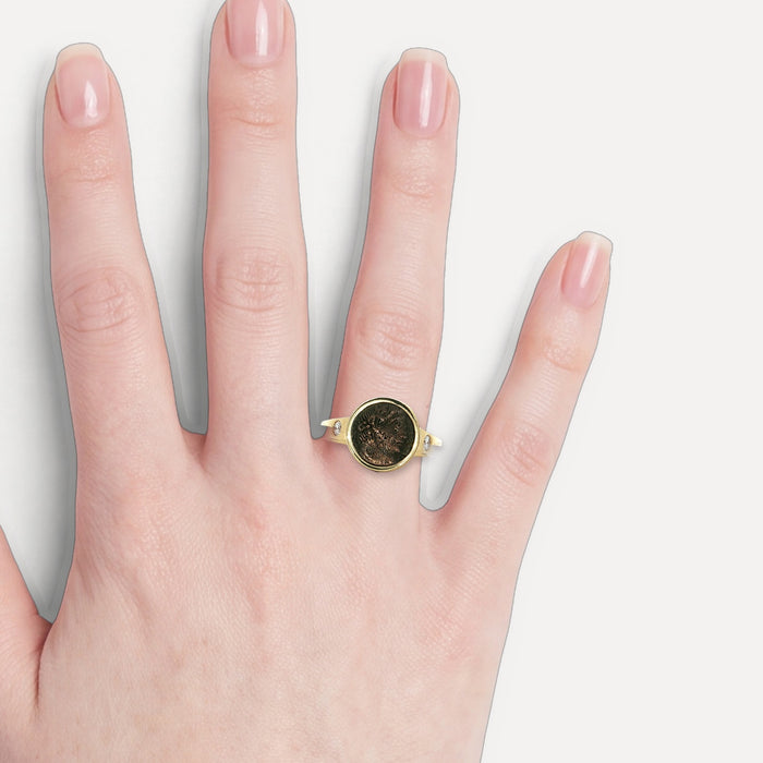 Ancient Marcus Aurelius Roman Coin (AD 161-180) & Colorless Diamond Ring (⅙ ct. tw.) in 14k Yellow Gold shown on a hand (light skin tone)