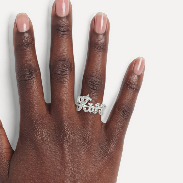 Round Brilliant Cut Near Colorless Pavé Diamond Ring (⅓ ct.) in 18k White Gold shown on a hand (deep skin tone)