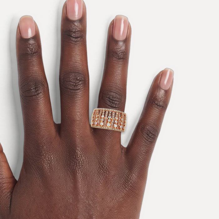 Round Brilliant Cut Nearly Flawless Colorless Birdcage Diamond Eternity Ring (1 ⅒ ct.) in 18k Rose Gold shown on a hand (deep skin tone)