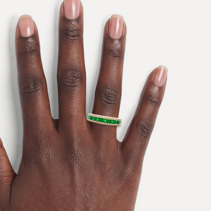 Princess Cut Emerald & Near-Colorless Diamond Band Ring (1 ⅖ ct. tw.) in 14k Yellow Gold shown on a hand (deep skin tone)