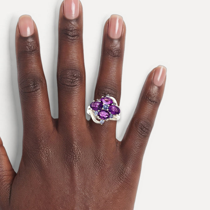 Purple & Sky Blue Split Shank CZ Ring in Sterling Silver shown on a hand (deep skin tone)