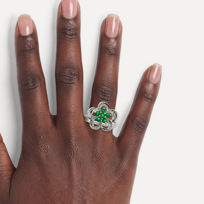 Flower Fashion Green & White CZ Ring in Sterling Silver shown on a hand (deep skin tone)