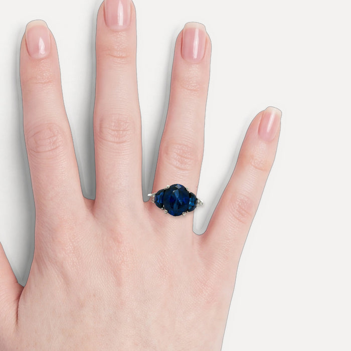 Moon Phase Sapphire Colored CZ Triple-Stone Ring in Sterling Silver shown on a hand (light skin tone)