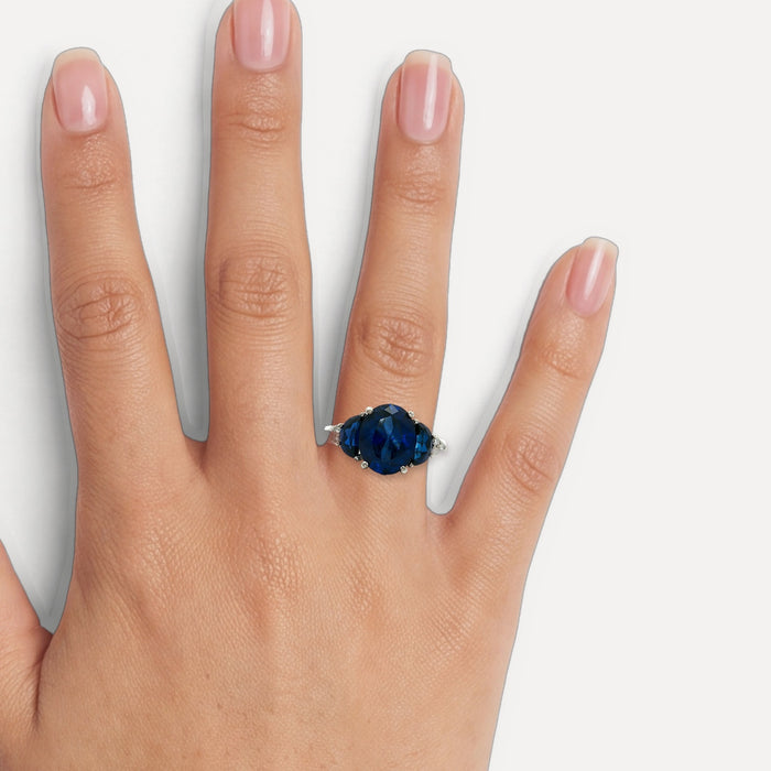 Moon Phase Sapphire Colored CZ Triple-Stone Ring in Sterling Silver shown on a hand (medium skin tone)
