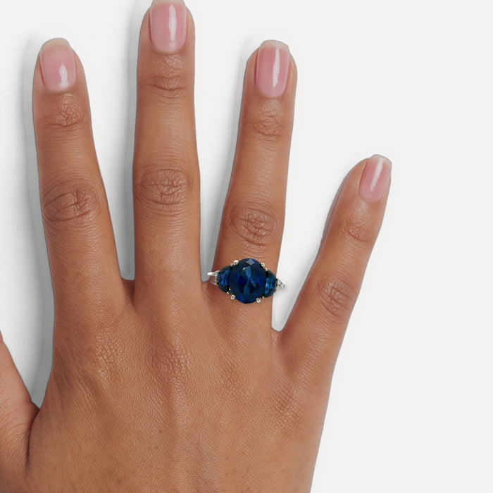 Moon Phase Sapphire Colored CZ Triple-Stone Ring in Sterling Silver shown on a hand (medium deep skin tone)