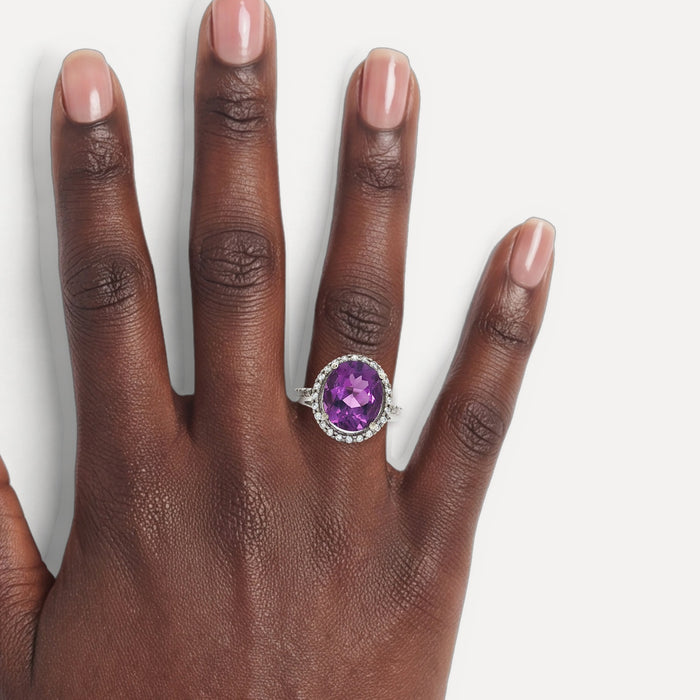 X-Large Amethyst Purple Oval CZ Halo Ring in Sterling Silver shown on a hand (deep skin tone)