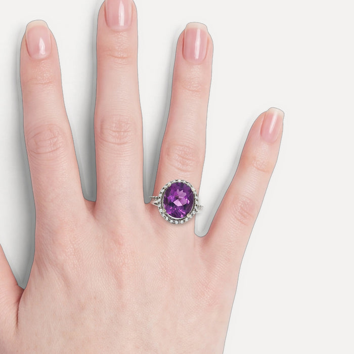 X-Large Amethyst Purple Oval CZ Halo Ring in Sterling Silver shown on a hand (light skin tone)