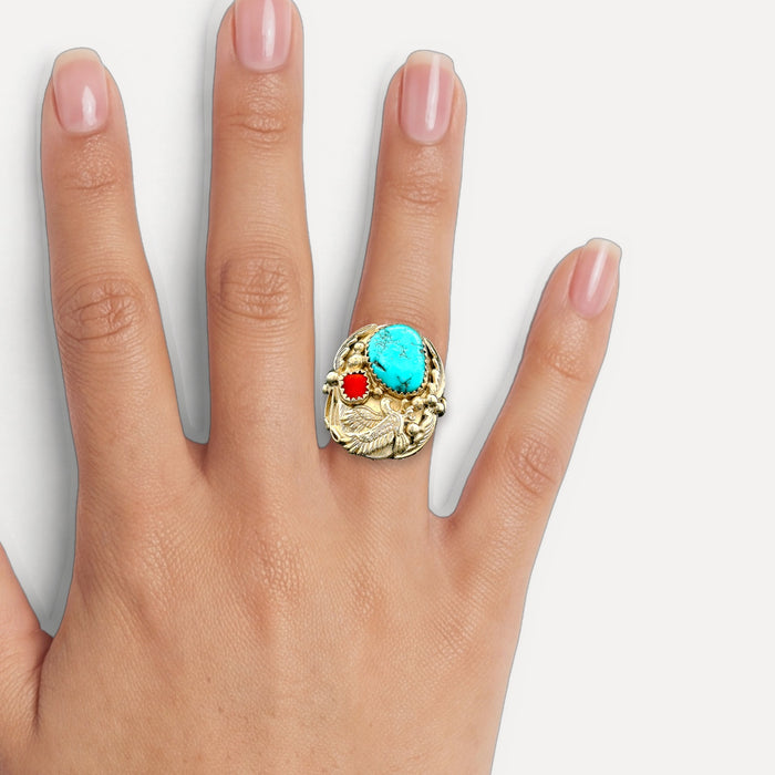 Native American Navajo Turquoise and Coral Bald Eagle Ring in Sterling Silver shown on a hand (medium skin tone)