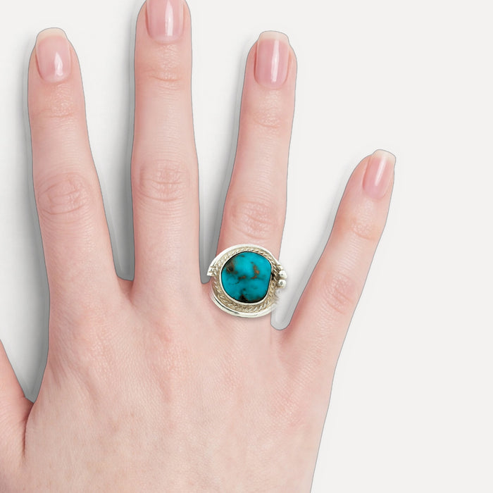Deep Turquoise Cocktail Ring in Sterling Silver shown on a hand (light skin tone)