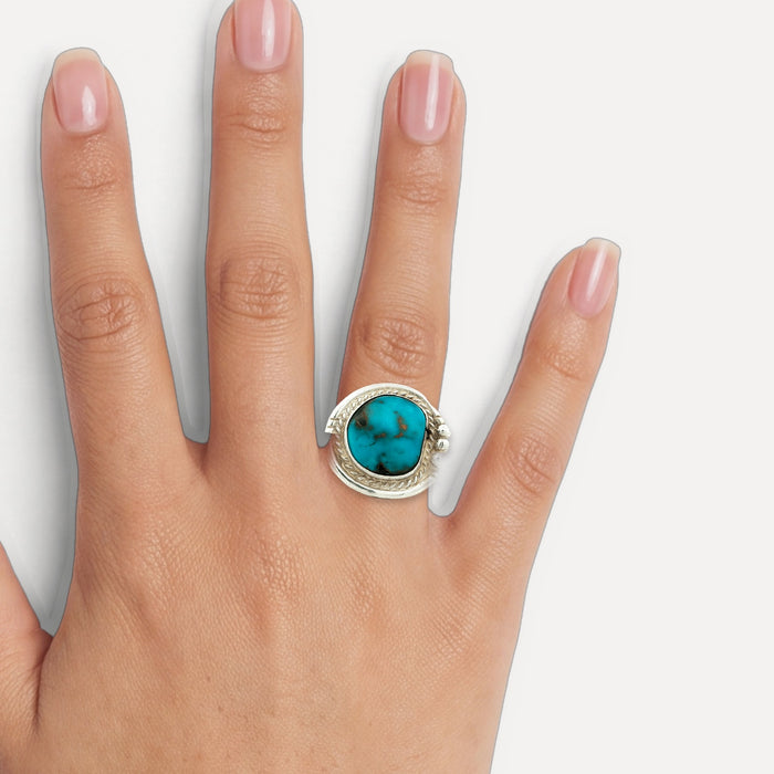 Deep Turquoise Cocktail Ring in Sterling Silver shown on a hand (medium skin tone)
