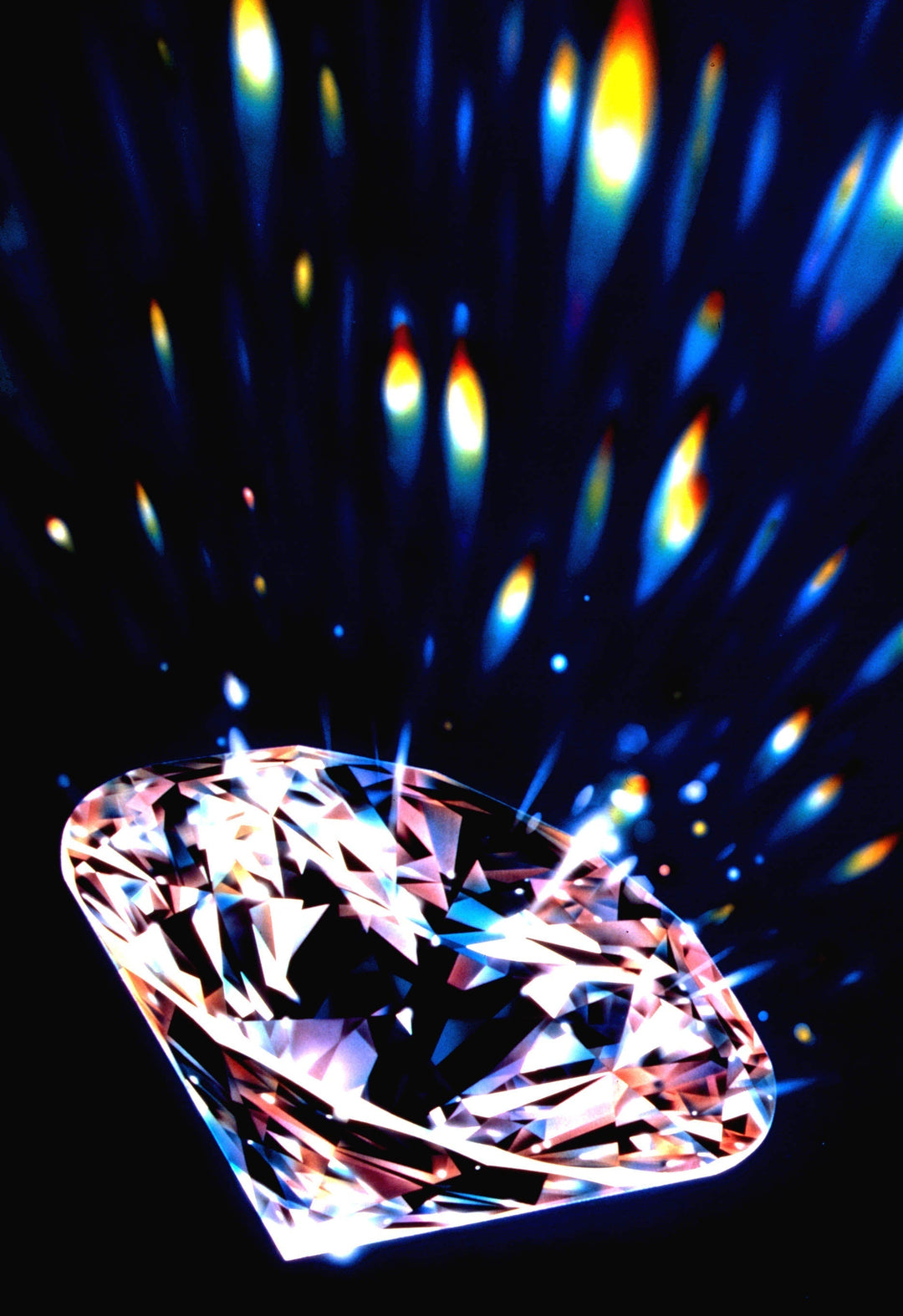 Loose diamond dispersing colorful light, illustrating the fire and brilliance produced by an excellent diamond cut