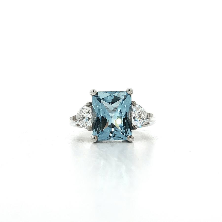 Radiant Cut Blue CZ Ring with Two Trillion Cut White Side CZs Sterling Silver