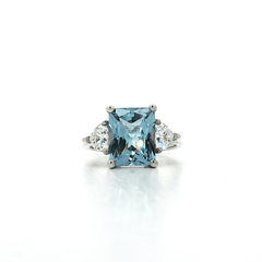 Radiant Cut Blue CZ Ring with Two Trillion Cut White Side CZs in Sterling Silver