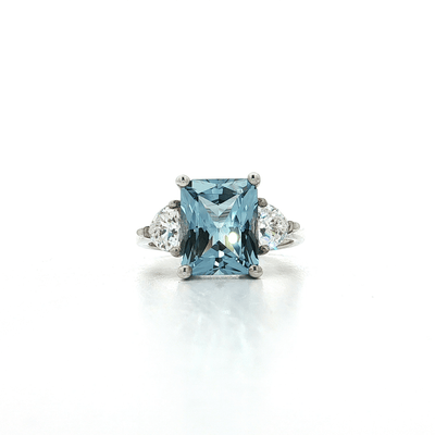 Radiant Cut Blue CZ Ring with Two Trillion Cut White Side CZs in Sterling Silver – Jewelry Depot, Inc.