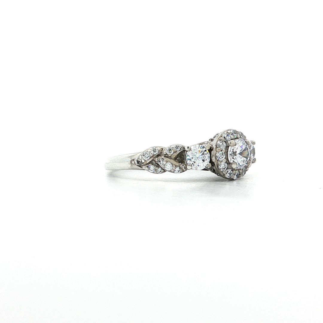 Three Stone Round Brilliant Cut CZ Engagement Ring with Halo in Sterling Silver