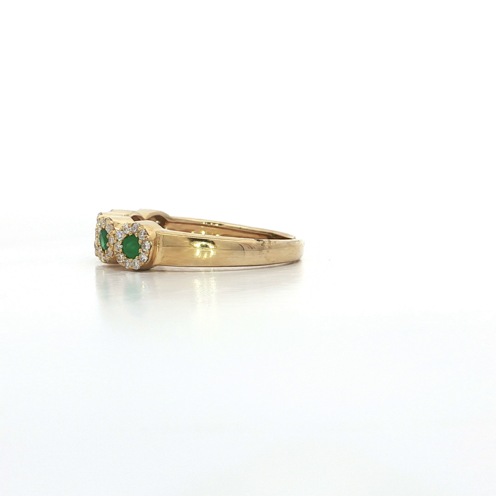 Round Emerald and Diamond Engagement Ring showcased in 14k Yellow Gold with emeralds and diamond halo.