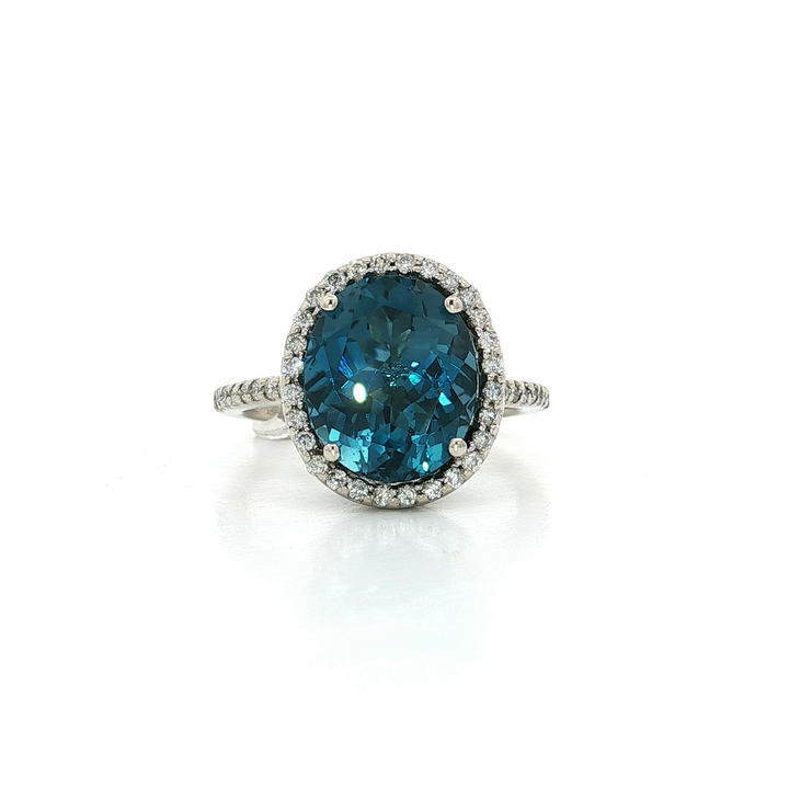 7.25 CTW AAAA Grade Oval Cut Natural London Blue Topaz and Natural Round Brilliant Cut Colorless Diamonds in a Halo Ring in 14kt White Gold
