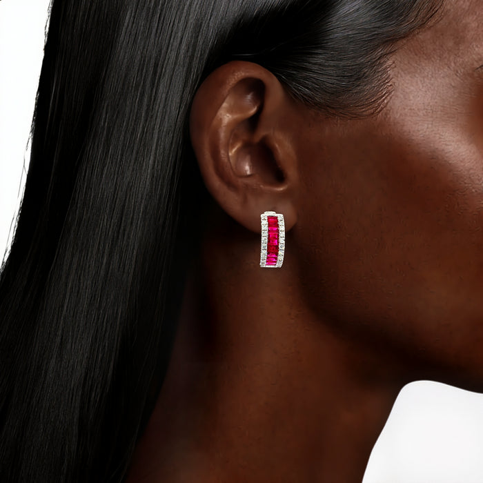 Vivid Baguette Ruby Colorless Nearly Flawless Channel-Set Diamond Hoop Earrings (3 ½ ct. tw.) in 18k White Gold shown on the ear (deepest skin tone)