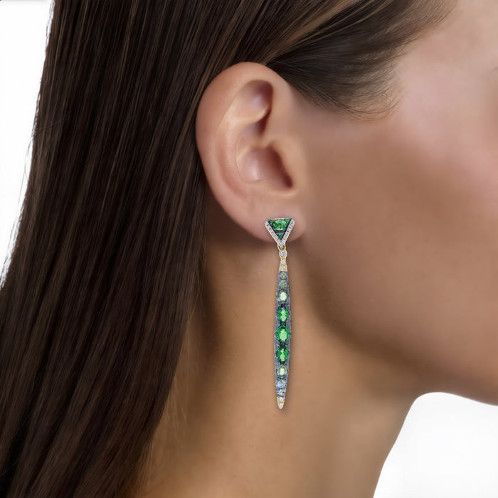 Vivid Tsavorite Green Garnet & Nearly Flawless Colorless Diamond Gradient Dangle Earrings (5 ⅖ ct. tw.) in 18k Yellow Gold shown on the ear (medium skin tone)