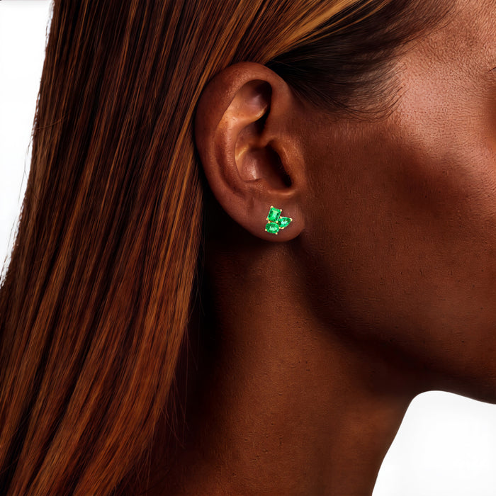Three-Stone Vivid Colombian Emerald Stud Earrings (1 ¾ ct. tw.) in 18k Yellow Gold shown on the ear (deep skin tone)