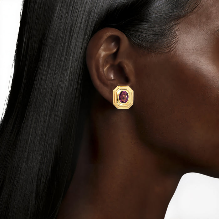 Oval Amethyst Stud Earrings (2 ¾ ct. tw.) in 14k Yellow Gold shown on the ear (deepest skin tone)