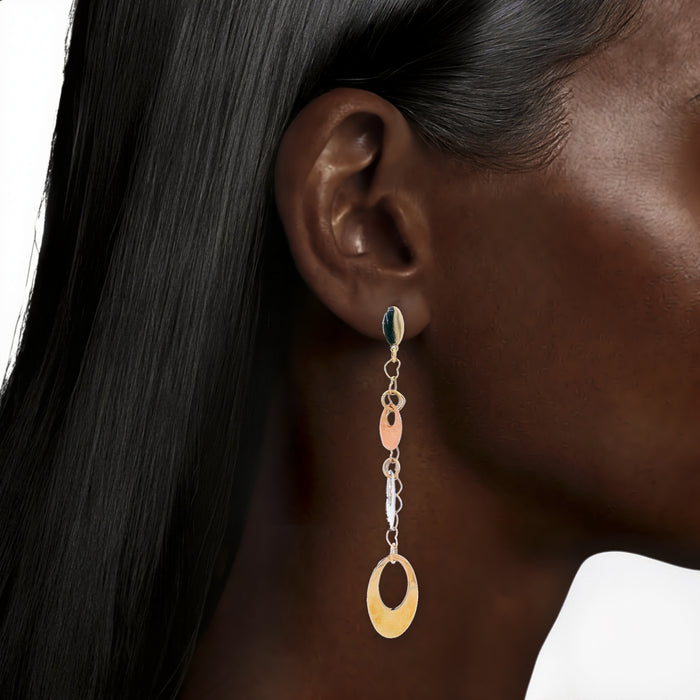 Tri-Color Gold Dangle Earrings in 14k Yellow, White, & Rose Gold shown on the ear (deepest skin tone)