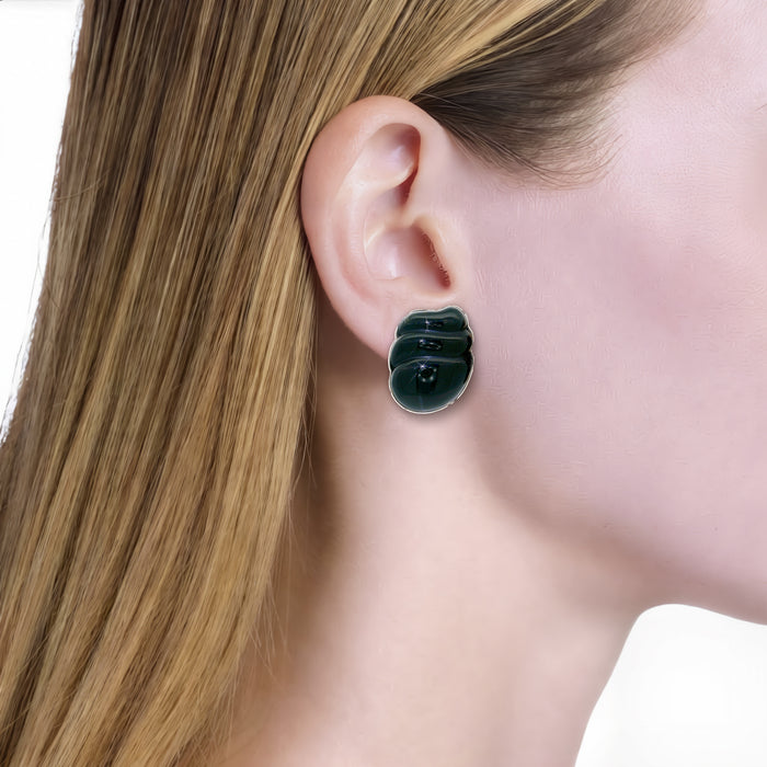 Vintage Onyx Clip-On Earrings in 14k Yellow Gold shown on the ear (light skin tone)
